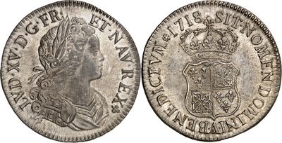 une vieille pièce d'argent ornée d'une couronne