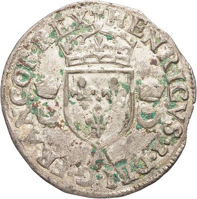 an old silver coin with a crown on top of it
