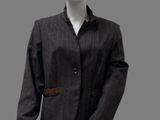 the mannequin is wearing a black suit with a brown belt