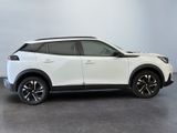 the white suv is parked in a room with a gray floor