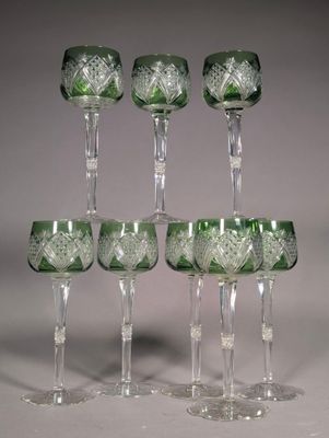 six green glass goblets are stacked on top of each other
