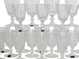 a lot of wine glasses that are sitting on the table