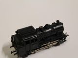 a toy train that is sitting on a white surface