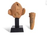 an image of a clay head next to a small piece of pottery