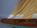 a model of a sailboat on display on a table