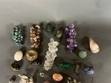 a close up of a bunch of different colored beads on a table