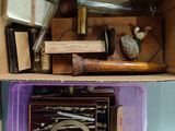 a purple box filled with assorted items sitting on a table