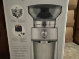 boxed box of a coffee grinder sitting on top of a table