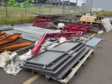 a pile of metal and wood on the side of the road