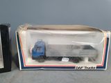 a box with a toy truck in it and a box with a toy truck in it
