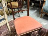 a chair that is sitting on a rug in a room