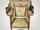an image of a chair with a floral upholstered back and arms