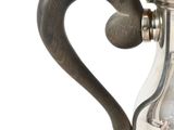 a silver coffee pot with a handle on a white background