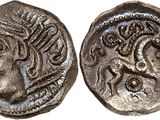 a silver coin with an image of a woman on it
