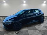 a black car parked in a garage with a checkered floor