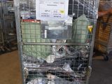 a metal cart with many items in it in a warehouse