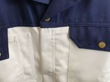 a close up of a blue and white jacket on a hanger