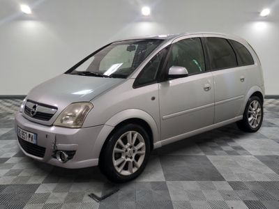 a picture of a silver car parked in a garage