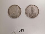 two silver coins with a picture of a church on one side and a smaller one on the other