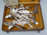 a case with silverware in it on a table