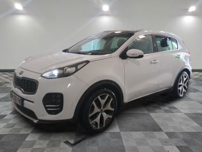 the white car is parked on a checkered floor in the garage