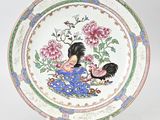 an image of a plate with a rooster and flowers on it