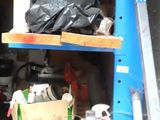 a garage with a lot of items on the shelves