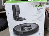 a box with a remote and a remote control on the floor