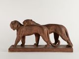 pair of bronze lions on a marble base