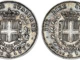 a silver coin with a crown on top of it