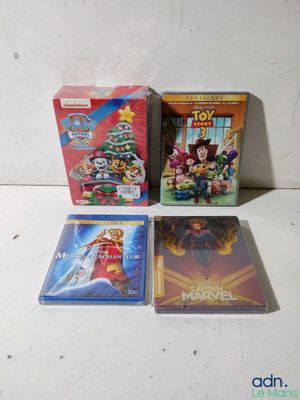 three dvd ' s are sitting on a table next to each other