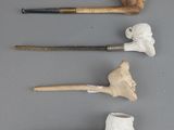 several different types of pipe smokings are lined up on a table