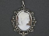 a close up of a picture of a woman ' s face in a silver frame