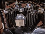 a close up of a motorcycle engine with a yellow sign on it