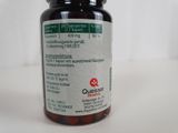 a bottle of vitamin pills on a table