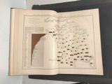 an open book with a map on it sitting on a table