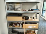 a shelf that has many items on it in the room