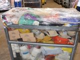 a cart that has many items on it in a warehouse