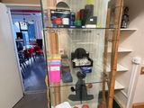 a glass display case with a lot of items in it