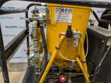 a yellow machine that is sitting on a cart