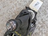 an overhead view of a car ' s headlight with a sticker attached to it