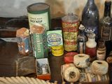 many different types of bottles and containers on the table