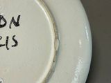 a white plate with black writing on it