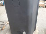 an image of a large black trash can in a warehouse
