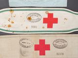 three pieces of cloth with different designs on them sitting on a table