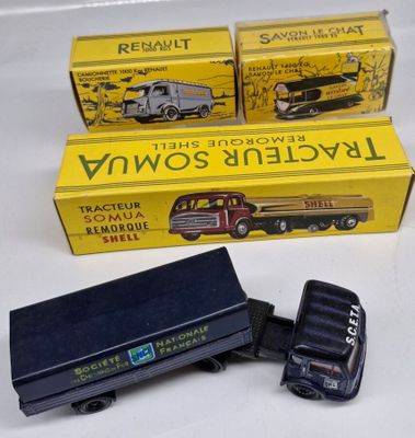 two toy trucks that are sitting next to each other