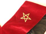 a red and black christmas stocking with a gold star on it