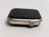 a close up of an apple watch on a white surface