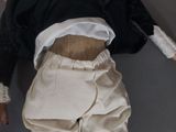 a doll that is laying down on the floor