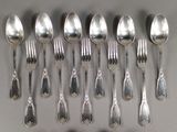 a lot of silver spoons and spoon spoons on a table